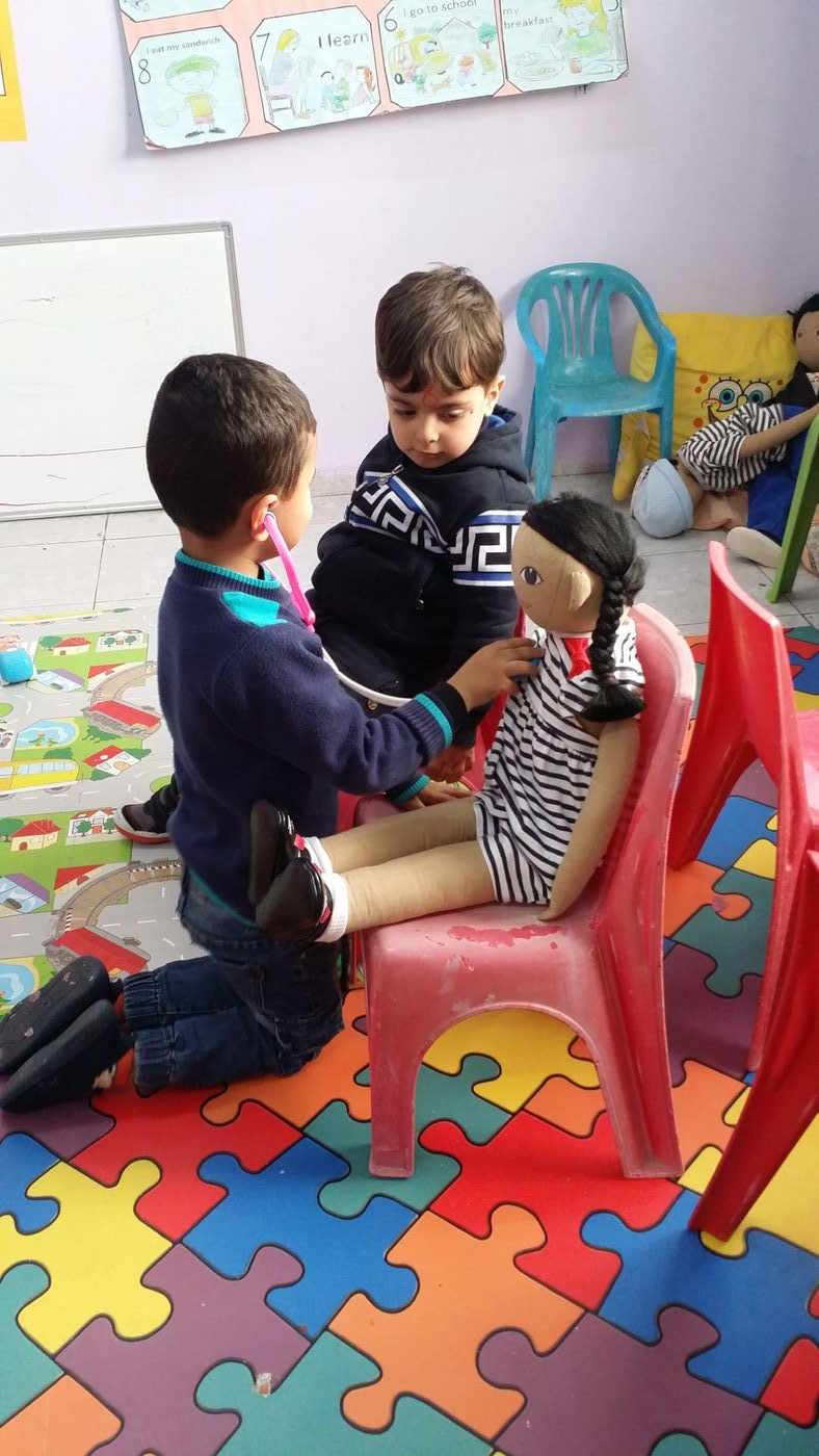 Children playing inside the original centre